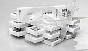 lateral flow antigen test kits stacked on top of each other