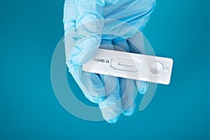 Lateral flow test,coronavirus cassette in the hand of a doctor in medical gloves