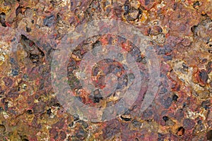 Laterite brick stone in rusty red color photo