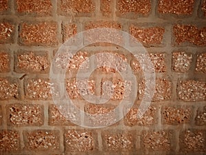 Laterite stone wall texture background.