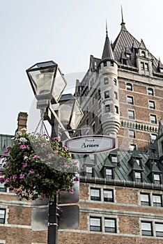Latern flowers sign Place d Armes Canada Quebec City front of Chateau Frontenac famous attraction UNESCO World Heritage photo
