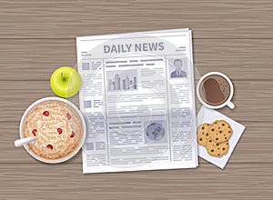 Latest news at breakfast. Daily Newspaper in the morning on a wooden table. Articles, headings.