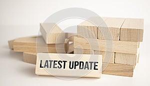 latest update 2022 word written on wood block. Time to update text on wooden table