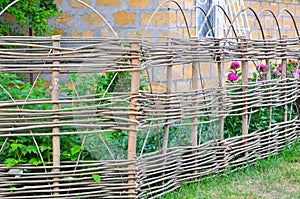 Lath fence around a farmer's house in Ukraine