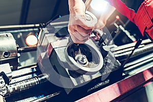 Lathe Machine Technician Processing a Piece of Metal