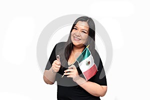 Latin adult woman shows her thumb inked with indelible electoral ink after exercising her right to free and secret voting