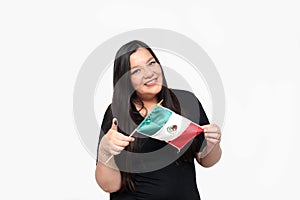 Latin adult woman shows her thumb inked with indelible electoral ink after exercising her right to free and secret voting