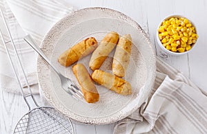 Tequenos made of fried corn filled with cheese