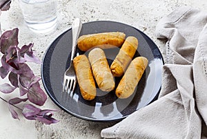 Tequenos made of fried corn filled with cheese