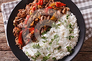 Latin American cuisine: ropa vieja with rice close-up. photo