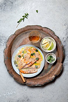 Latin American Italian dish Crudo de Salmon Raw Salmon fish platter marinated in lemon juice and spices. Top view