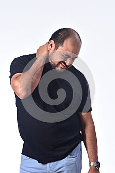 Latin american man with pain on nape on white background