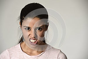 Latin angry and upset woman looking furious and crazy moody in intense anger emotion