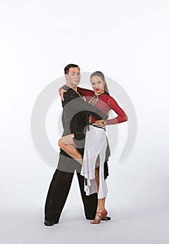 Latin Ballroom Dancers with Black and Red Dress - Leg Lifted