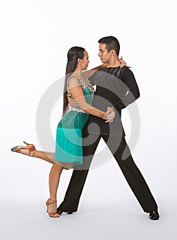Latin Ballroom Dancers with Green Dress = Leg Up