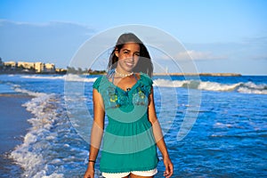 Latin beautiful girl in Caribbean beach sunset