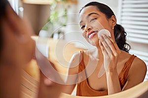 Latin beautiful woman using cotton pads for cleaning face