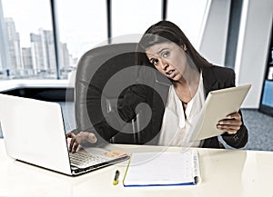 Latin business woman suffering stress working at office compute