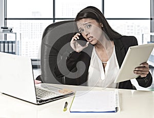 Latin business woman suffering stress working at office computer