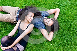 Latin Couple on meadow sleeping in summer