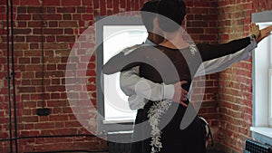 Latin dances - man and woman training their couple dance in the studio