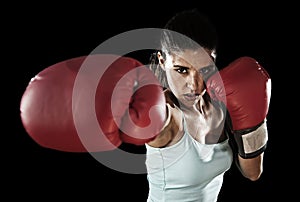 Latin fitness woman with girl red boxing gloves posing in defiant and competitive fight attitude