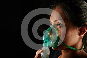 Latin girl with inhale mask