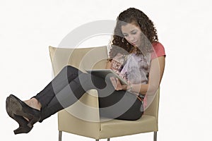 Latin girl reading from a tablet