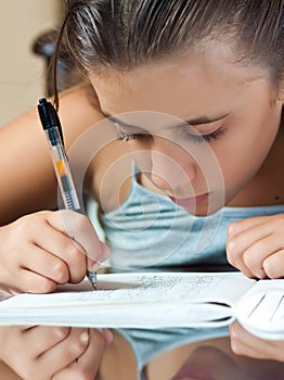 Latin girl working on her school homework