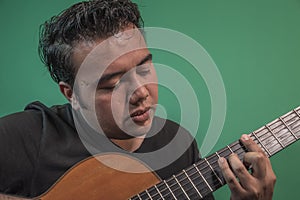 Latin happy guy playing guitar