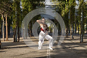 Latin and Hispanic girl, young and beautiful, dancing modern dance in the street outdoors. Dance concept, moonwalk, jumpstyle,