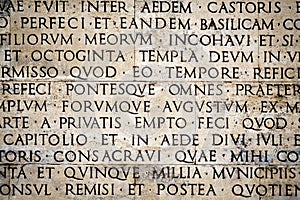 Latin inscription on the outside wall of Ara Pacis wall in Rome, Italy