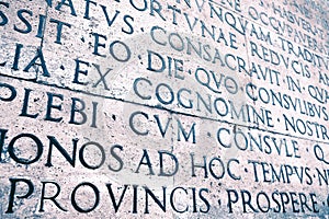 Latin inscription on the outside wall of Ara Pacis wall in Rome, Italy