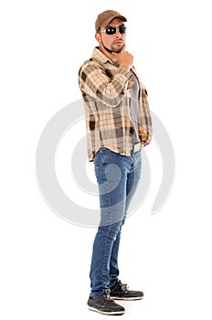 Latin man in flannel shirt cap and sunglasses