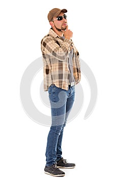 Latin man in flannel shirt cap and sunglasses photo
