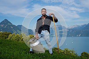Latin Man in grass farm. Ecology concept. Sexy Farmer with bare naked torso. Muscular sexy Farmer in the farm field