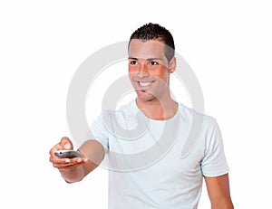 Latin man pointing with remote control