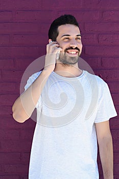 Latin man talking on the phone