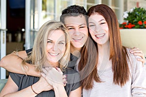 Latin mother and her teenage children.