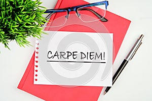 The Latin phrase Carpe Diem, a quote from Horace, means seize the moment.