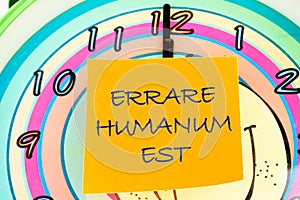 Latin quote Errare humanum est, meaning It is human nature to make mistakes. Mistakes are inherent in human existence. Text photo