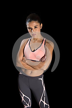 Latin sport woman posing in fierce and badass face expression with fit slim body