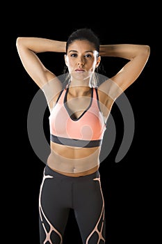 Latin sport woman posing in fierce and badass face expression with fit slim body