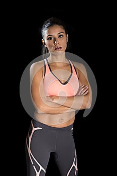 Latin sport woman posing in fierce and badass face expression with fit slim body