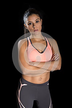 Latin sport woman posing in fierce and badass face expression with fit slim body