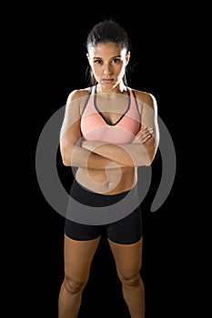 Latin sport woman posing in fierce and badass face expression with fit slim body