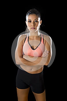 Latin sport woman posing in fierce and badass face expression with fit slim body