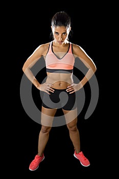 Latin sport woman posing in fierce and badass face expression with fit slim body