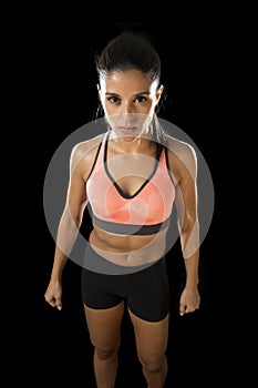 Latin sport woman posing in fierce and badass face expression with fit slim body