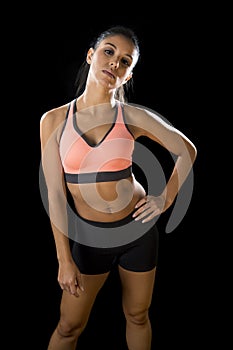 Latin sport woman posing in fierce and badass face expression with fit slim body